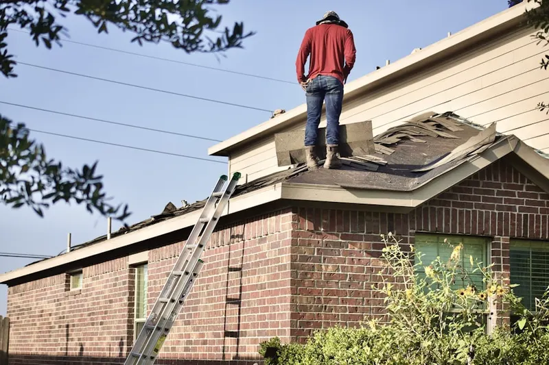 Professional roofer working on a residential roof in Lone Mountain Vista